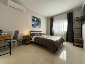 A bed or beds in a room at BaySide1 Marsaxlokk Malta