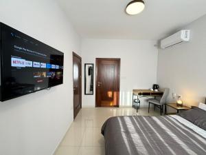 A television and/or entertainment centre at BaySide1 Marsaxlokk Malta
