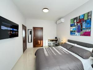 A television and/or entertainment centre at BaySide1 Marsaxlokk Malta