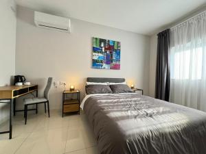 A bed or beds in a room at BaySide1 Marsaxlokk Malta