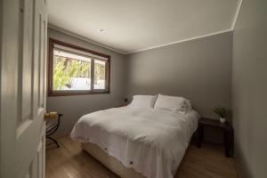 Säng eller sängar i ett rum på Cabañas Sierra Nevada