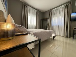 A bed or beds in a room at BaySide1 Marsaxlokk Malta