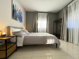 A bed or beds in a room at BaySide1 Marsaxlokk Malta