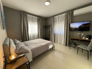 A bed or beds in a room at BaySide1 Marsaxlokk Malta