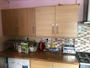 a kitchen with wooden cabinets and a counter top at 275 in Nottingham