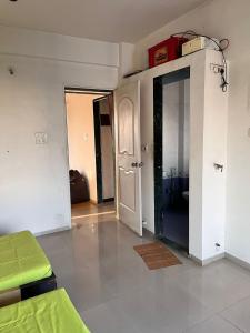 a living room with a room with a door and a room with at 2BHK Fully Furnished Penthouse With Living Hall And Kitchen Krishi Nagar Nashik in Nashik