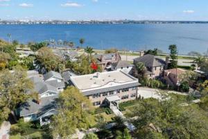 an aerial view of a house next to the water at The Adaline Room #5 - Upscale Hyde Park Apartment, 1st Floor, Steps to Bayshore in Tampa