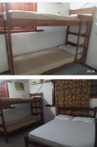 - deux lits superposés dans une chambre dans l'établissement Bangalô Amarelo, à Prado