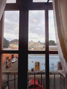 a view of a city from a window at La soledad in Oaxaca City