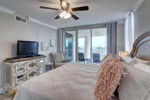 a bedroom with a bed and a flat screen tv at St Maarten 308 a Renovated Luxury Beach Front 3 Bedroom 3rd Floor Condo with Resort Amenities in Destin