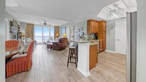 a kitchen and living room with a view of the ocean at St Lucia 1204 a Luxury Condo with Gulf Views in Destin