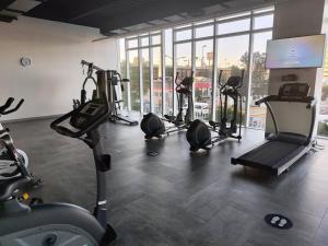 a gym with several treadmills and machines in a room at Toreo, polanco. in Mexico City