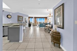 a kitchen and dining room with a tile floor at St Maarten 402 a Luxury Beachfront 3 Bedroom Condo Elevator Opens Into Unit in Destin