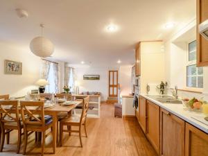 a kitchen and dining room with a table and chairs at 3 Bed in Argyll Bute 90478 in Tighnabruaich