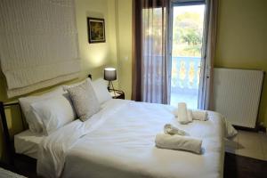 Postel nebo postele na pokoji v ubytování Deppy's House κοντά στα λουτρά Πόζαρ