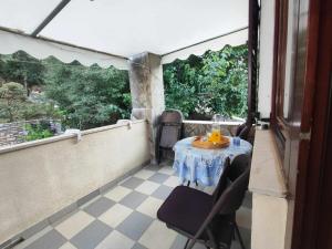 a table on the balcony of a house at Apartments by the sea Basina, Hvar - 116 in Vrboska