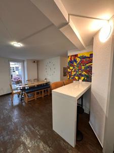 a living room with a table and a pool table at Stay2Night City Center Hostel in Zürich