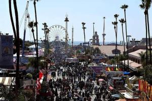 a large crowd of people walking around a fair at Adorable Octopus Hideaway: 2 min walk to the beach in Del Mar