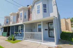 a large white house with a porch at Arcade Nook & New Sea Turtle Mural- 3BR in Atlantic City