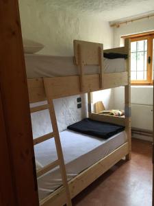 a couple of bunk beds in a room at Pra de Gnela in Pedavena