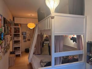 a childs room with a bunk bed and a staircase at Central family home in award-winning architecture in Copenhagen