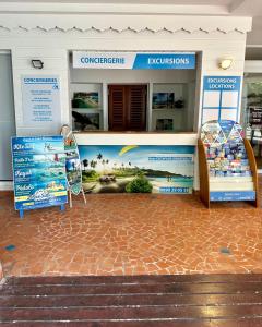 a building with a sign in front of it at Tropical Cocooning in Saint-François