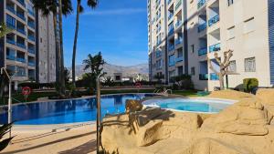 a swimming pool in the middle of a building at TERRAMAR sweet home in Villajoyosa