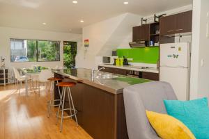 a kitchen with a sink and a counter at Aqua Soleil Villas in Whitianga