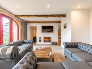 a living room with couches and a fireplace at 7 Bed in Allendale 78160 in Catton