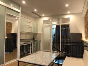 a living room with a table and a kitchen at miniHomestay green view & warm pool - all apartment - 3 room - 6 persons - Ea Kar - Dak Lak in Buôn Mhang