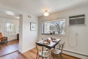 a dining room with a table and chairs and a window at Eclectic Stone Cottage, Walk to Downtown Staunton! in Staunton