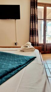 Postel nebo postele na pokoji v ubytování Allotino Hotel - Café & snacks