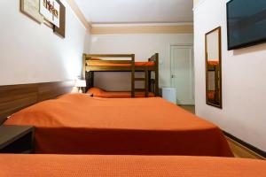 Voodi või voodid majutusasutuse Hotel Excelsior toas