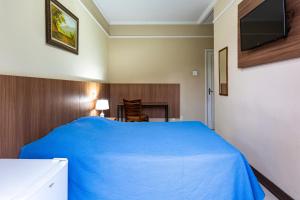 Voodi või voodid majutusasutuse Hotel Excelsior toas