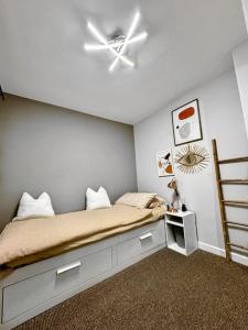 a bedroom with a bed with a ceiling fan at Luxury Accommodation Denton in Denton