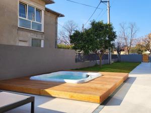 a hot tub sitting on top of a wooden deck at Firefly Luxury Apartment with private Whirlpool in Zadar
