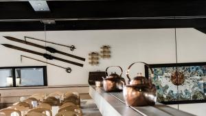 a room with some tea pots on a table at Rondablikk Fjellstasjon in Mysusæter