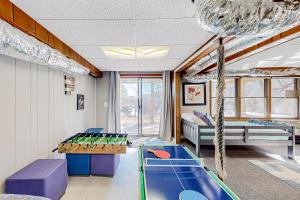 a childrens room with a ping pong table at The Lost Bridge Lakehouse in Garfield