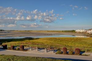 a park with benches and a body of water at Aspinquid Resort in Ogunquit
