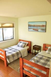 a bedroom with two beds and a window at Cozy & affordable, Spacious Condo by the lake in Incline Village