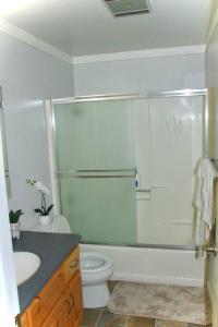 a bathroom with a shower and a toilet and a sink at Cozy & affordable, Spacious Condo by the lake in Incline Village