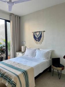 Un pat sau paturi într-o cameră la Villa Paraíso Costalegre