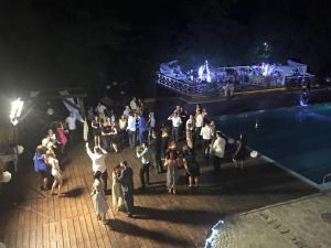 a group of people standing on a pier at night at Mountain View Hotel Complex in Yabulkovets +92 photos