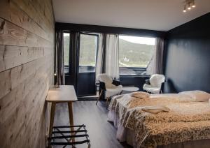 Ένα ή περισσότερα κρεβάτια σε δωμάτιο στο Rondablikk Fjellstasjon