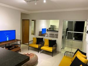 Televisi dan/atau pusat hiburan di Apartamento Luxo em Uberaba