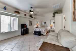 a living room with a couch and a bed at 4 Mi to San Tan Mtn Trails Arizona Studio! in Queen Creek