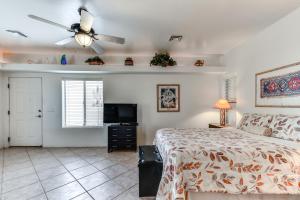 a bedroom with a bed and a ceiling fan at 4 Mi to San Tan Mtn Trails Arizona Studio! in Queen Creek