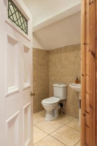 a bathroom with a toilet and a sink at Number 29, a Grade two listed house in Masham in Masham