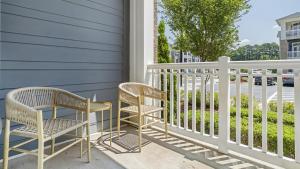 two chairs and a table on a porch at Landing Modern Apartment with Amazing Amenities (ID1286X424) in Chapel Hill