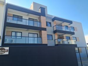an architectural rendering of a building with balconies at Apartamento Pé na Areia in Itapoa
